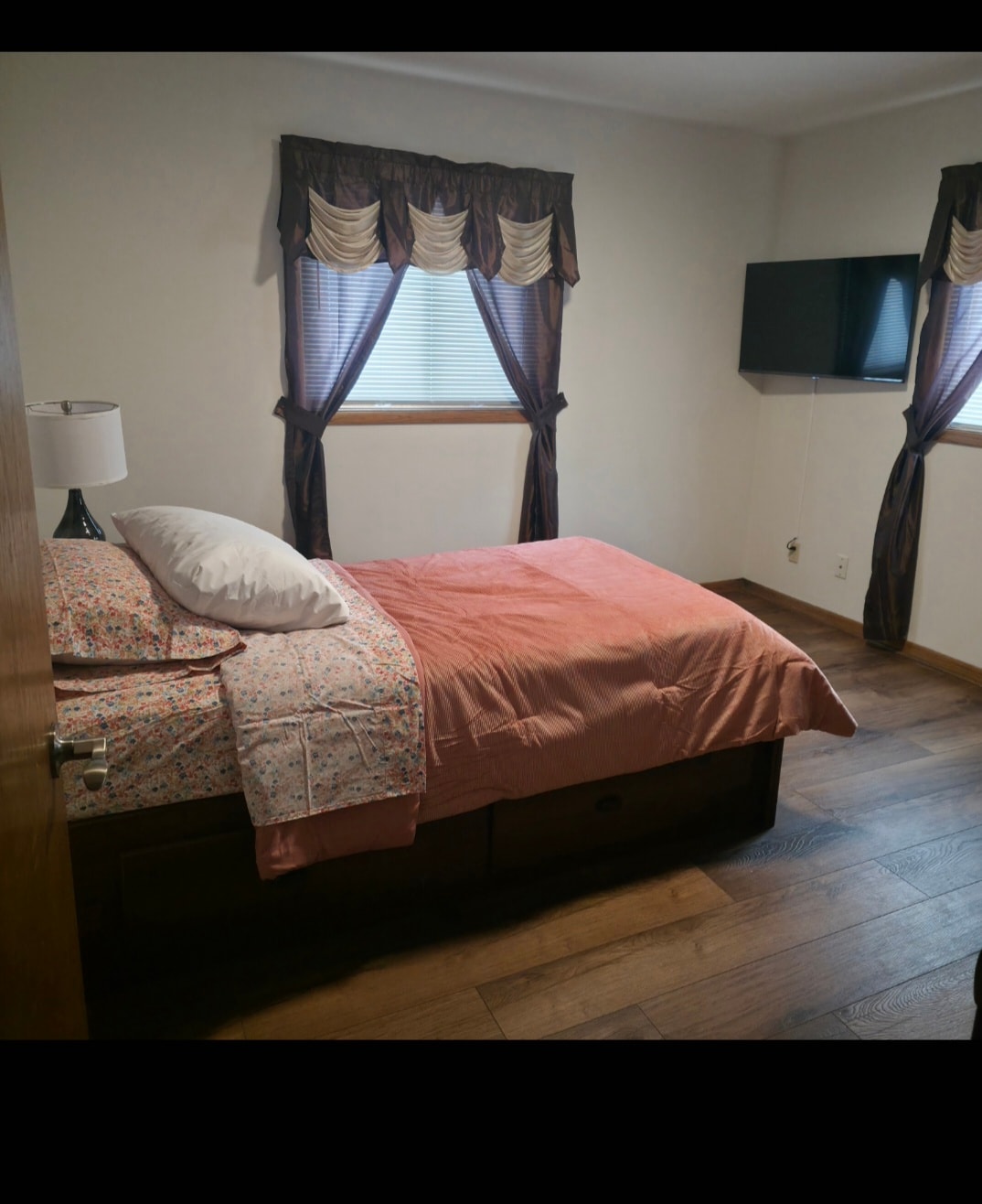 Bedroom with bed and draped windows at Floxy AbilityNest